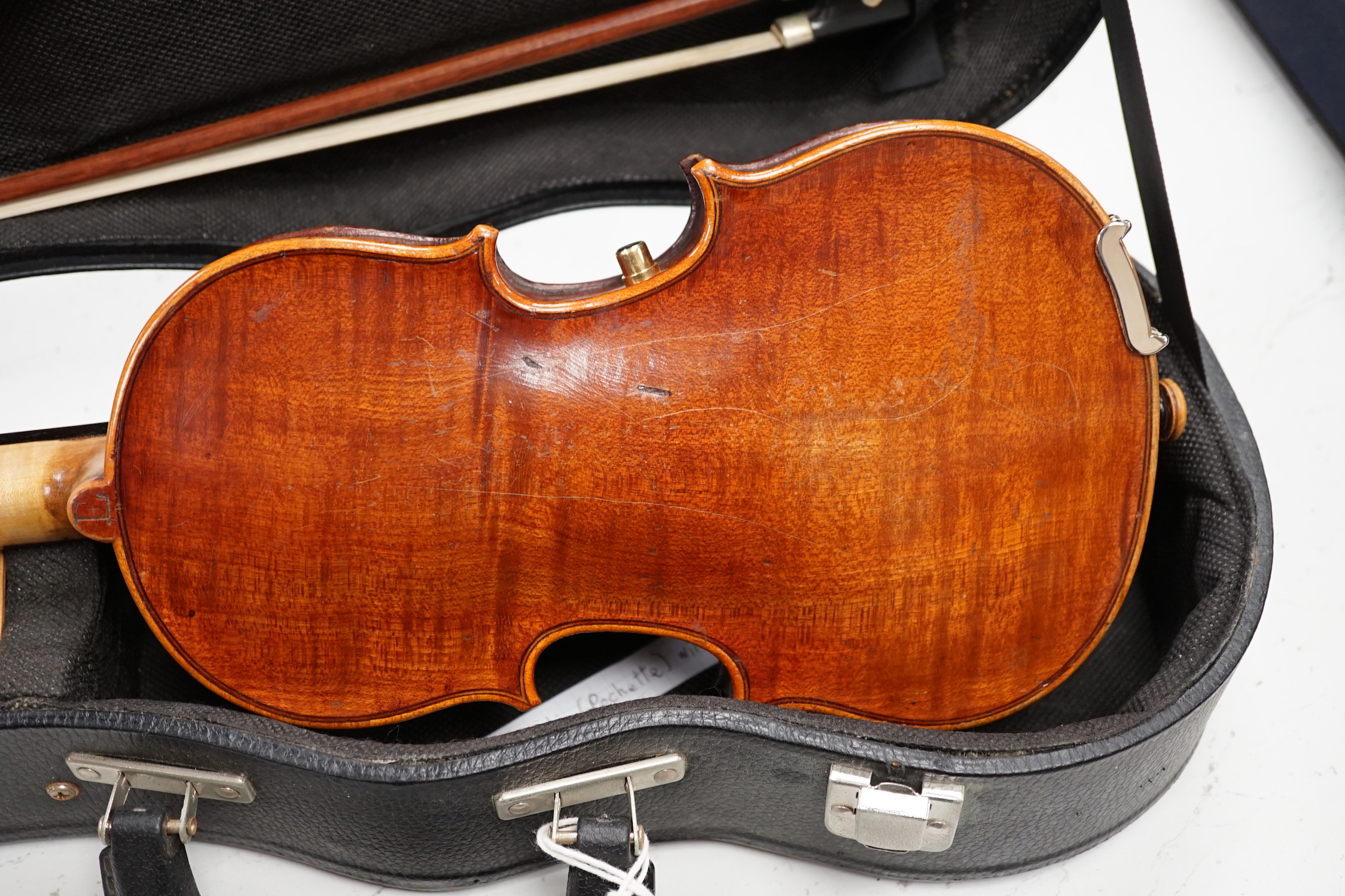 An unusual travelling violin (Pochette), length of body, 25.5cm, with standard length neck, with shorter 53.5cm bow and fitted case, overall length of violin 55cm